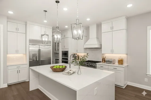 a kitchen with refrigerator and cabinets