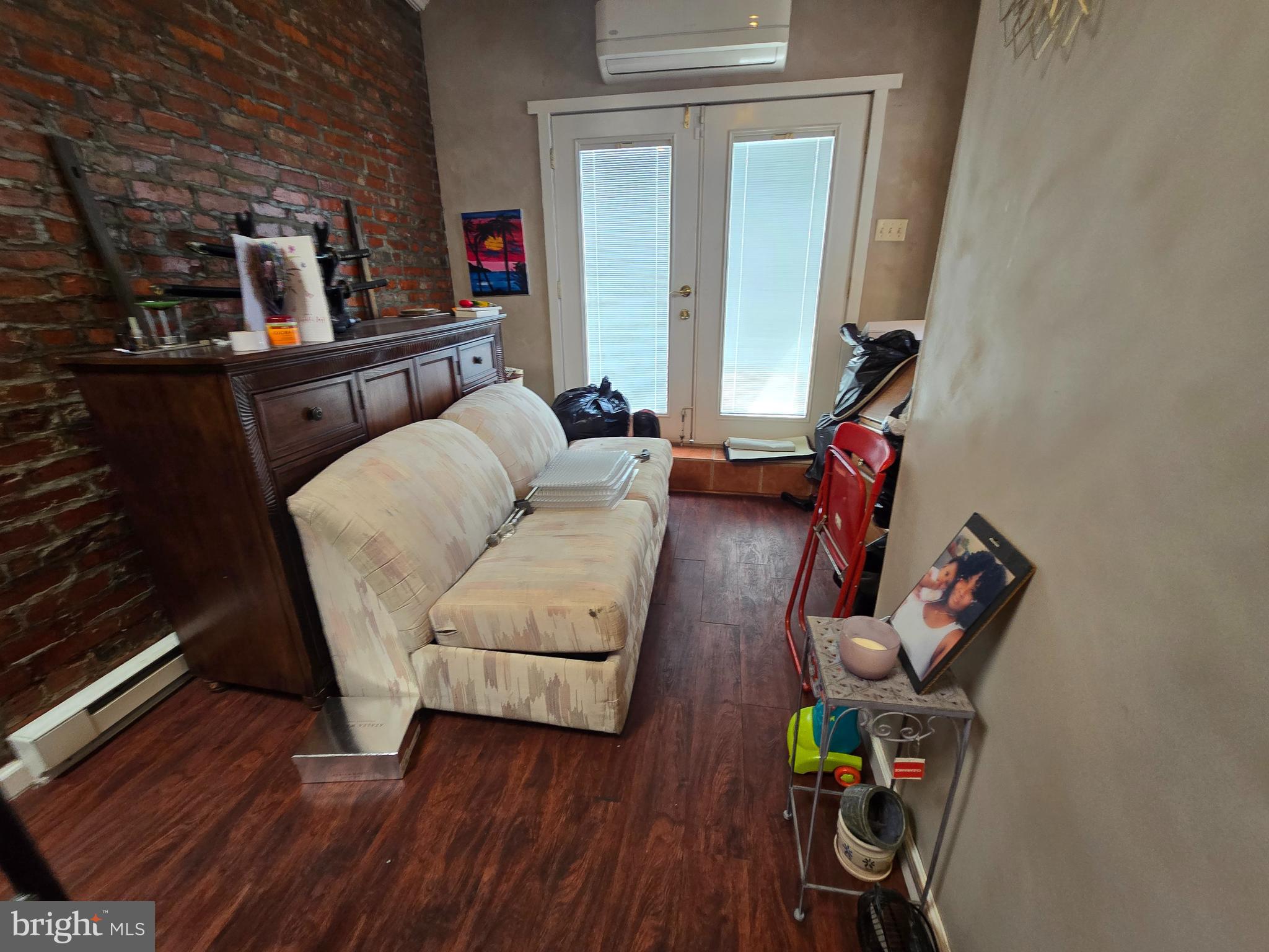 1211 North 60th Street Philadelphia, PA 19151 - Photo 11 of 14 a living room with furniture and a wooden floor