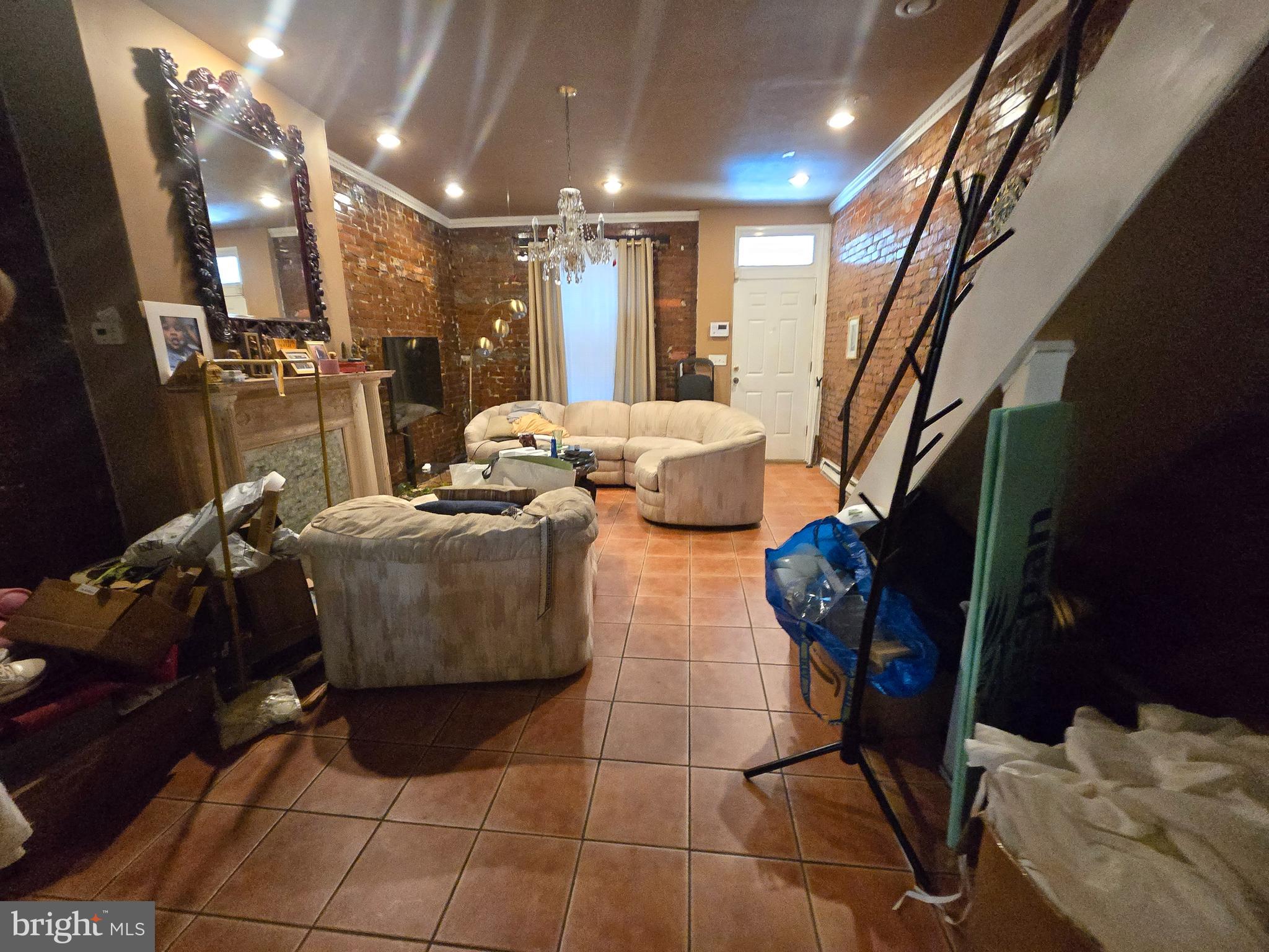 1211 North 60th Street Philadelphia, PA 19151 - Photo 3 of 14 a living room with furniture and a mirror