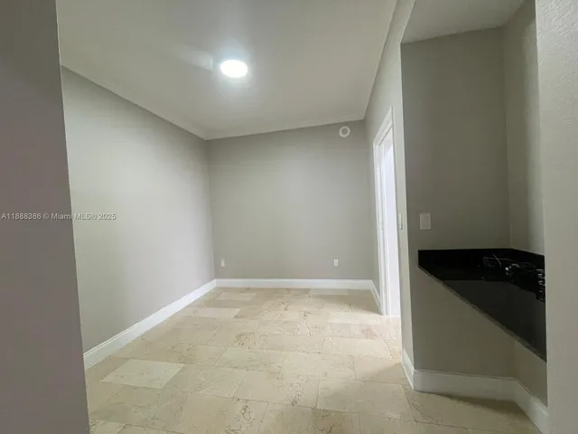 an empty room with wooden floor