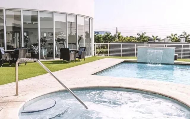a view of a swimming pool with a lounge chairs