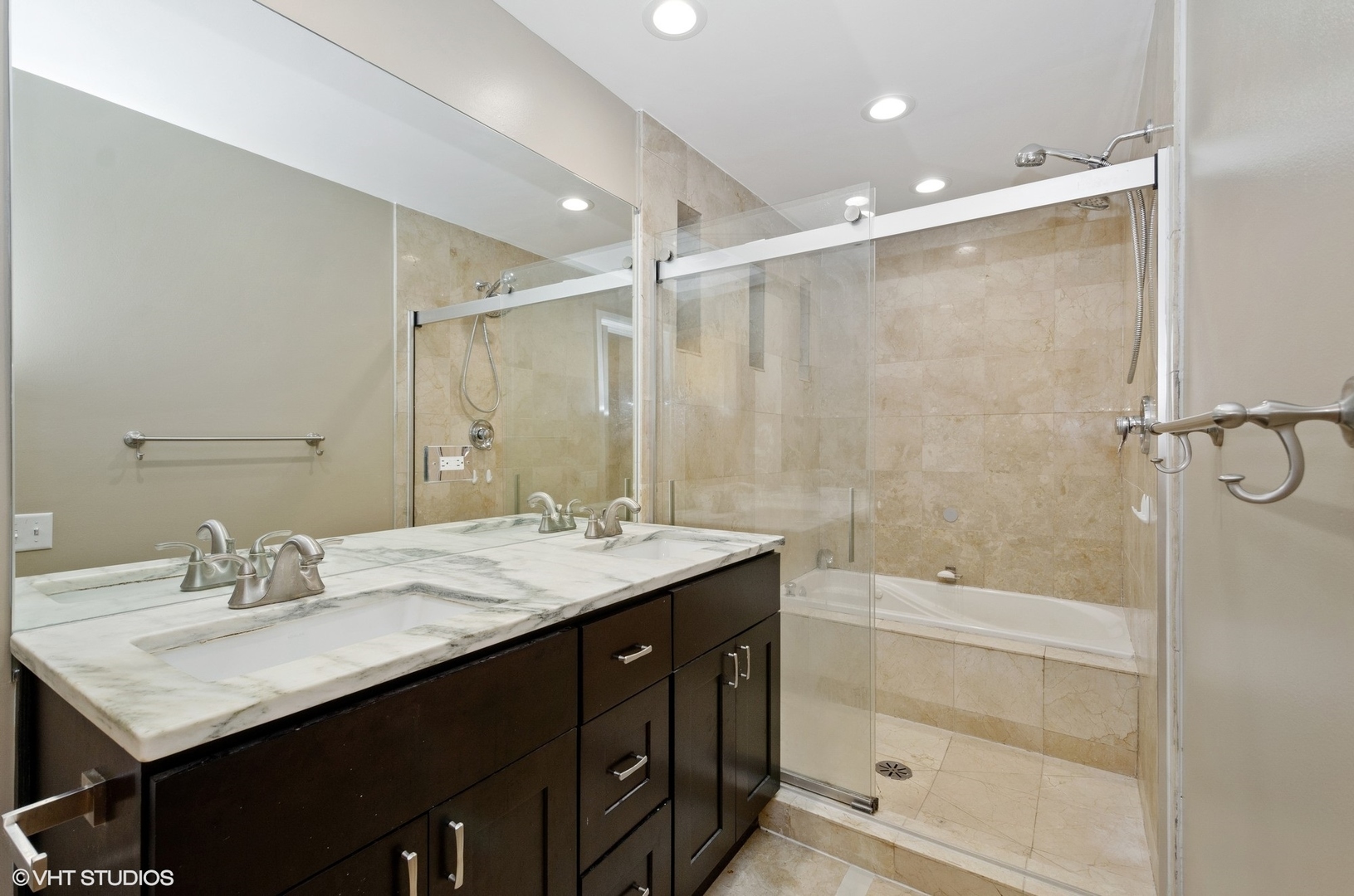 1442 North Mohawk Street, Unit 1 Chicago, IL 60610 - Photo 11 of 15 a bathroom with a sink double vanity granite tub shower and a mirror