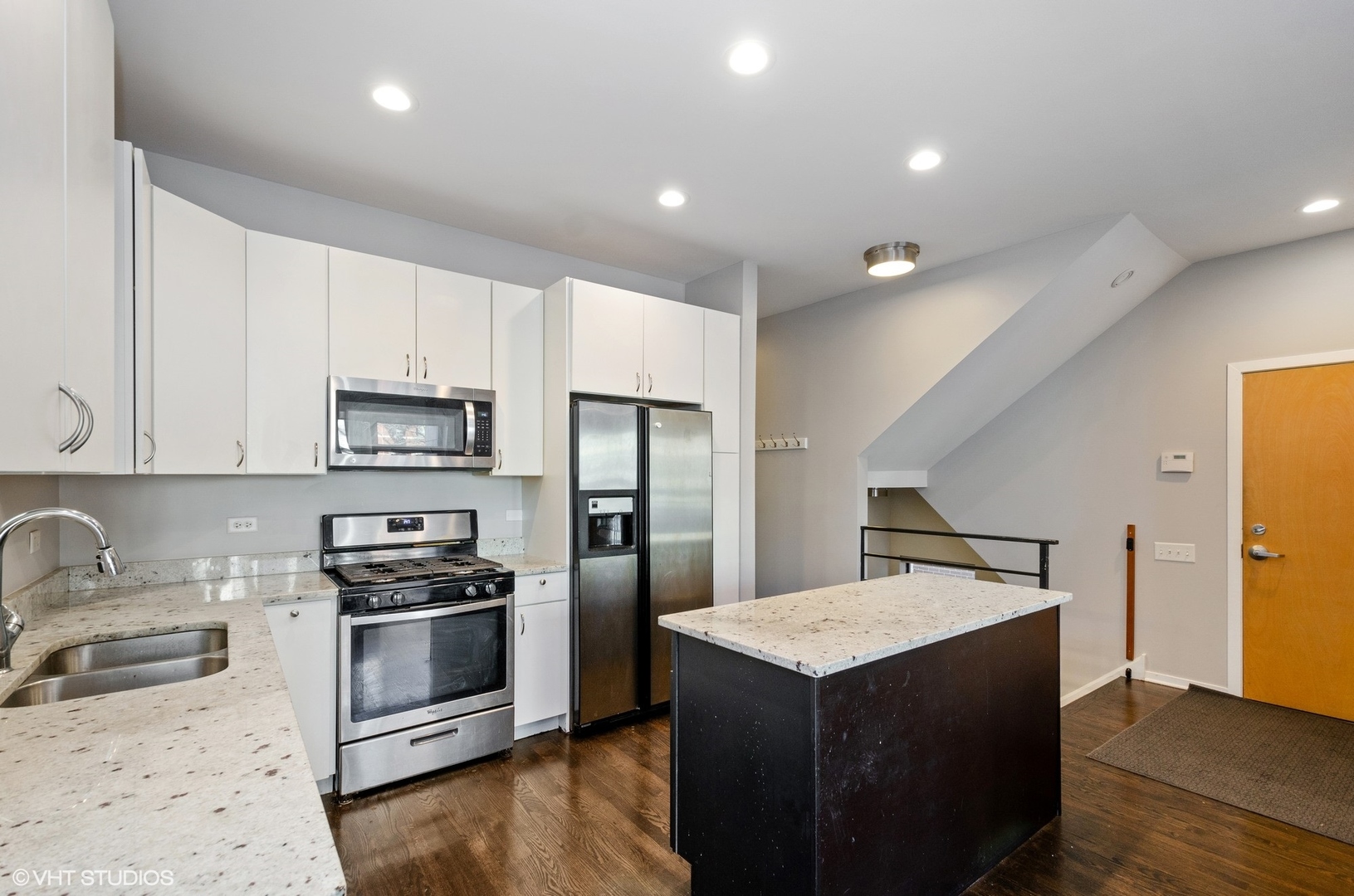 1442 North Mohawk Street, Unit 1 Chicago, IL 60610 - Photo 6 of 15 a kitchen with stainless steel appliances granite countertop a refrigerator a stove a sink and a microwave