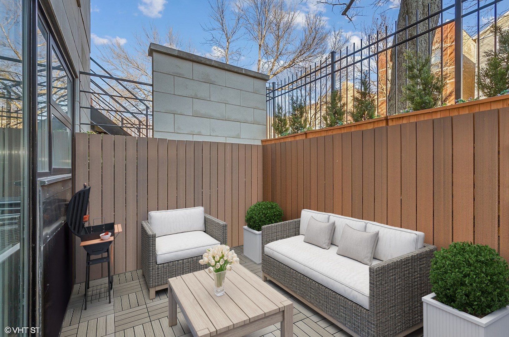 1442 North Mohawk Street, Unit 1 Chicago, IL 60610 - Photo 10 of 15 a backyard of a house with couches fire pit and outdoor seating