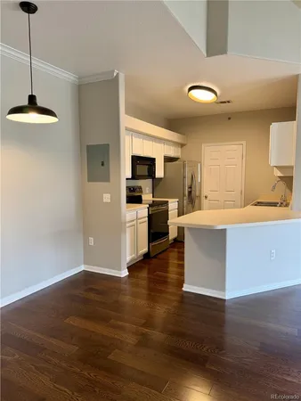 a kitchen with a stove microwave and sink