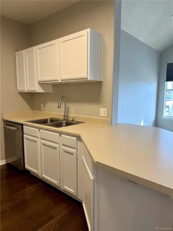 a bathroom with a double vanity sink mirror and toilet