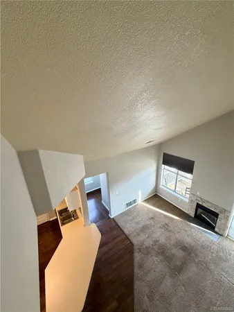 a bedroom with a bed and a night stand