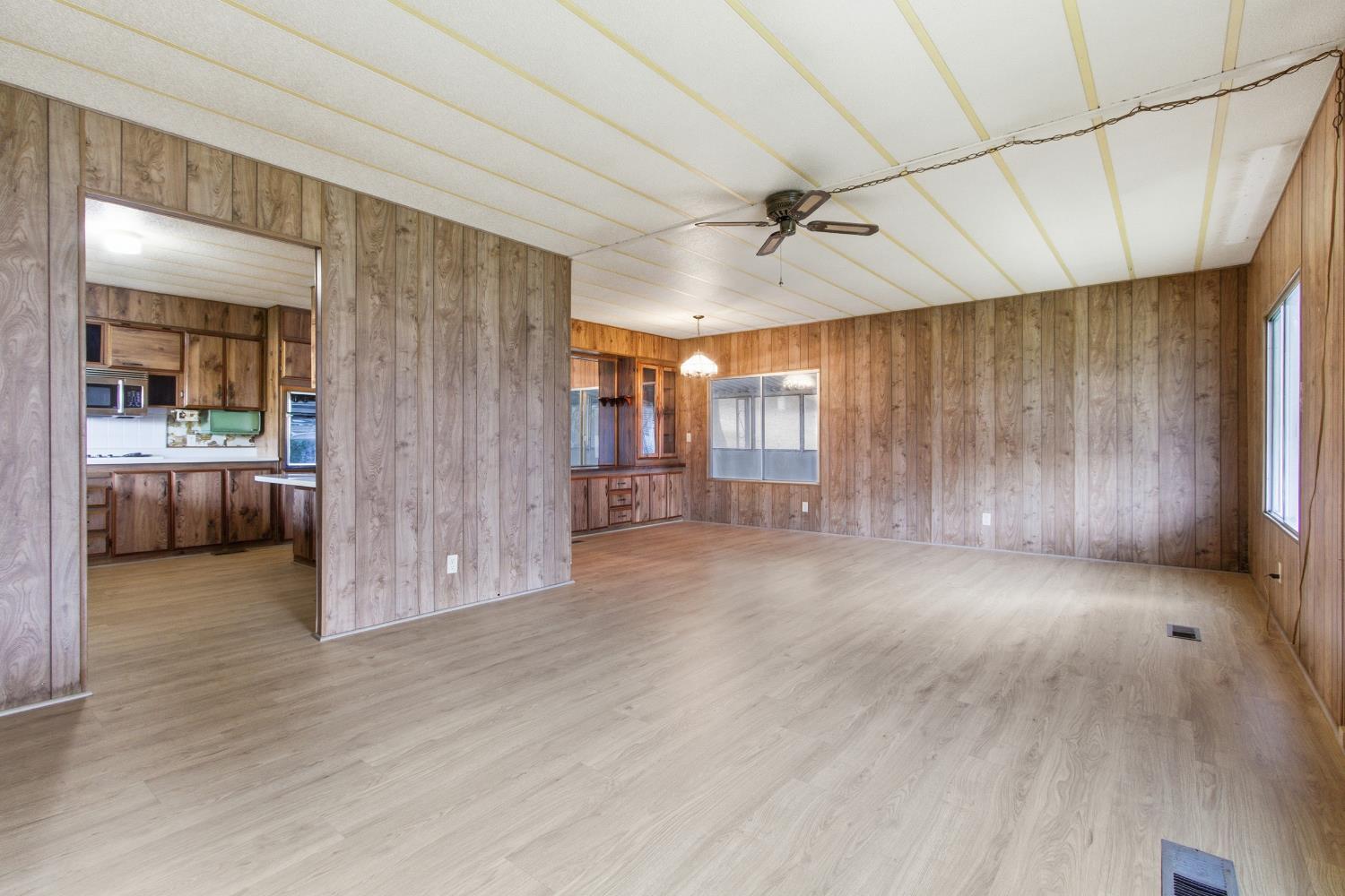 4117 El Dorado Road Placerville, CA 95667 - Photo 38 of 54 a view of a hallway with wooden floor and a bathroom