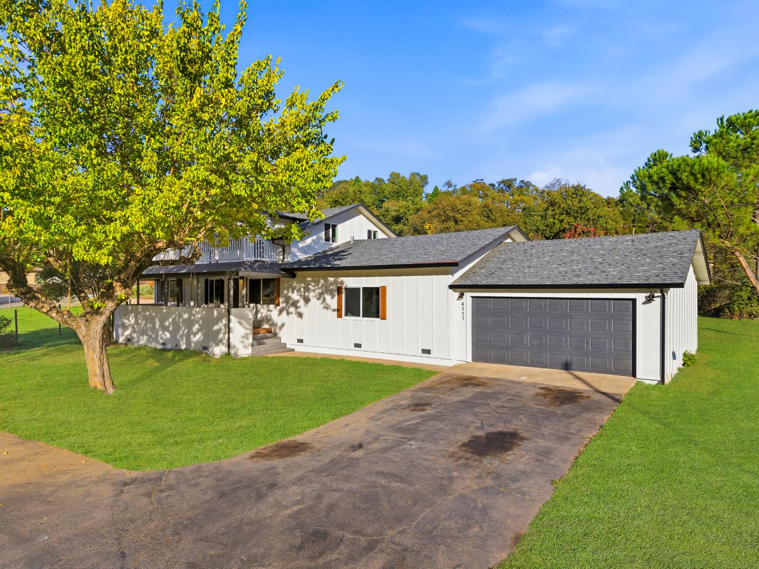 4117 El Dorado Road Placerville, CA 95667 - Photo 4 of 54 a front view of a house with a garden