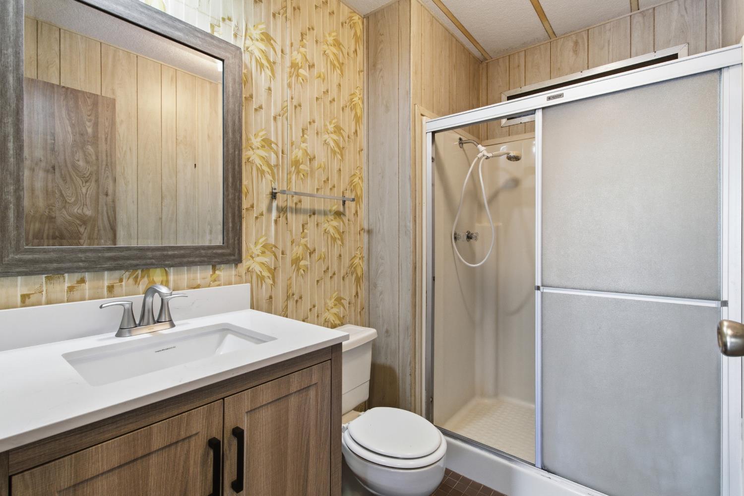 4117 El Dorado Road Placerville, CA 95667 - Photo 45 of 54 a bathroom with a sink a toilet and shower