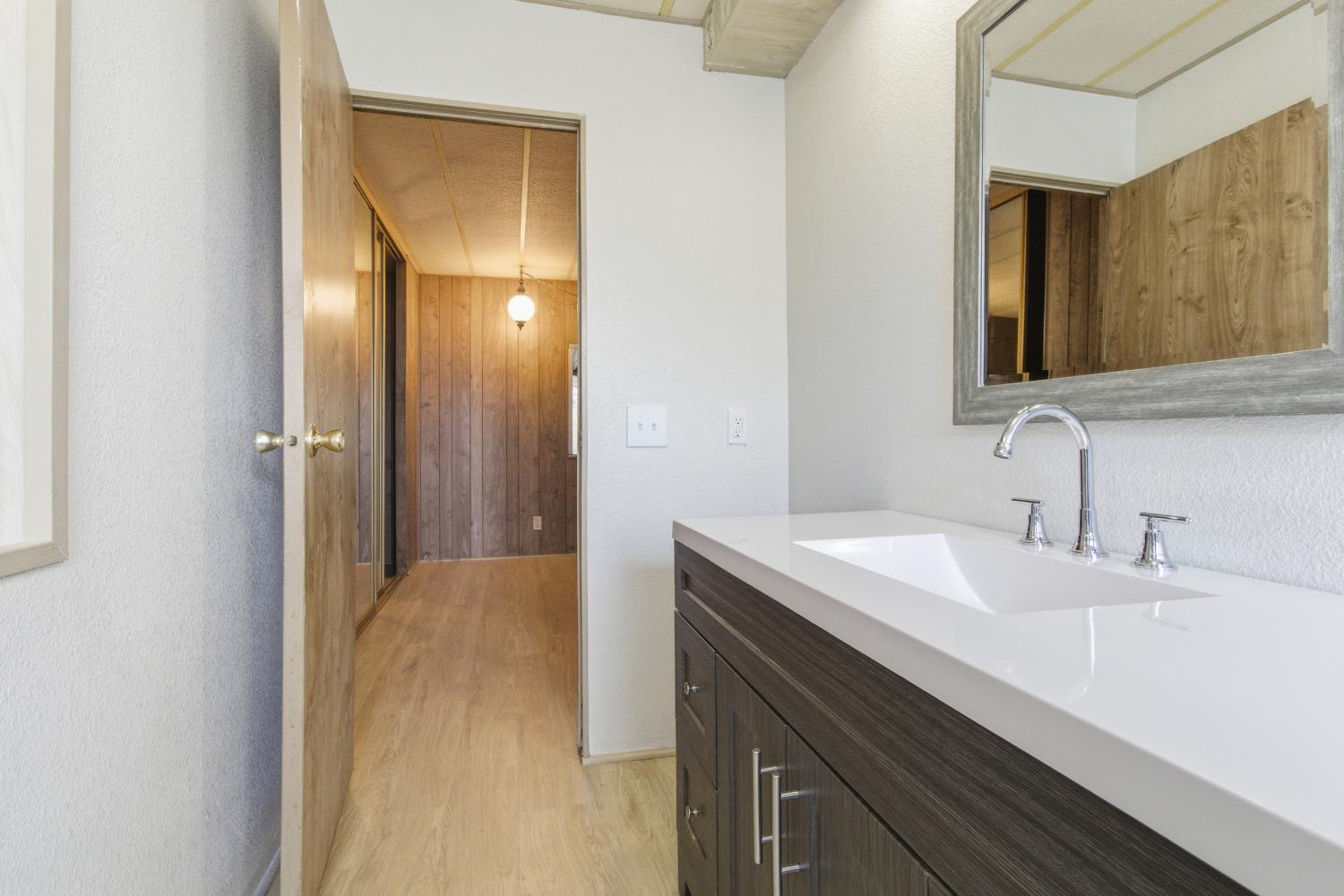 4117 El Dorado Road Placerville, CA 95667 - Photo 49 of 54 a bathroom with a sink and a mirror