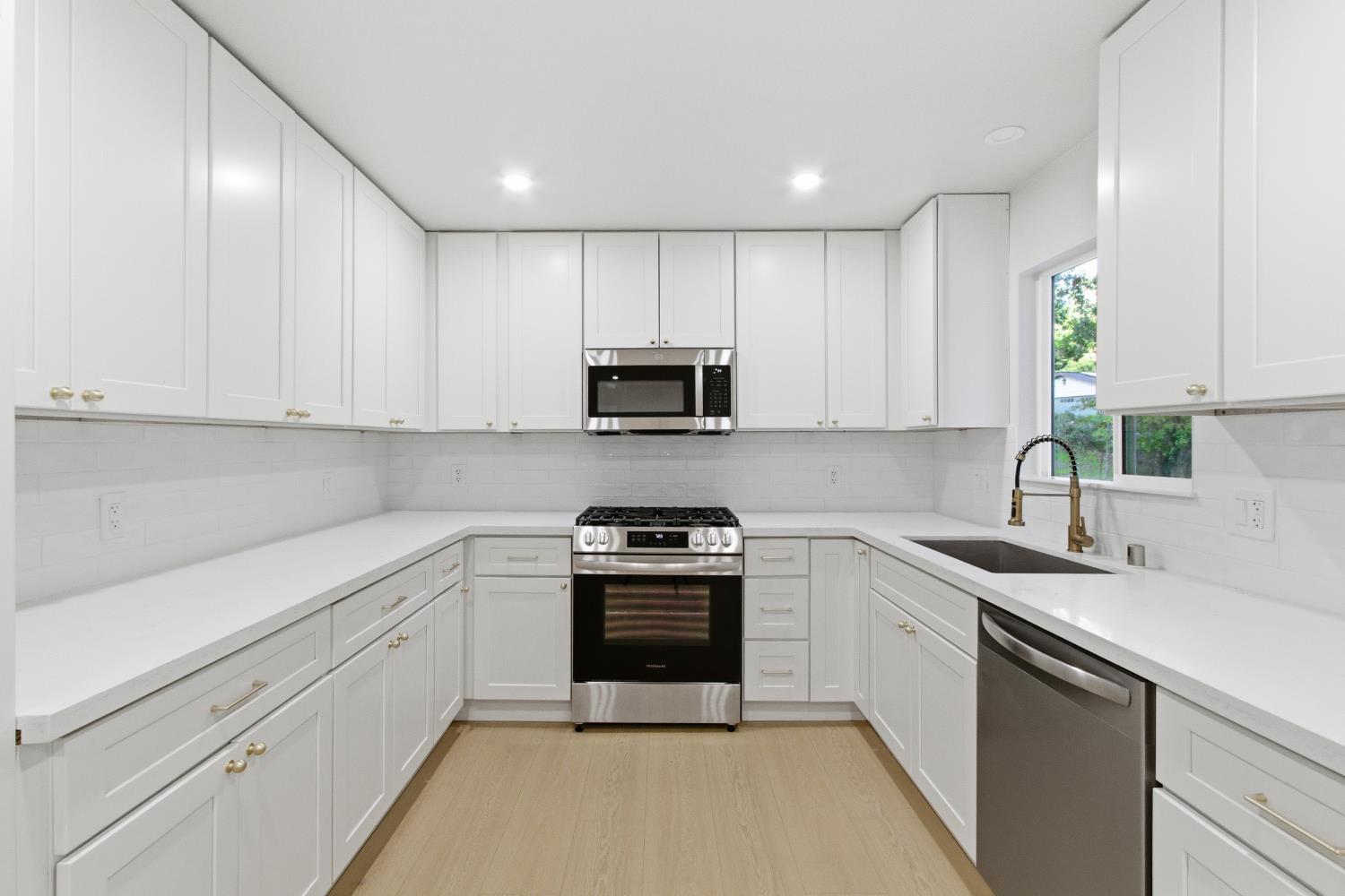 4117 El Dorado Road Placerville, CA 95667 - Photo 10 of 54 a kitchen with white cabinets appliances and a sink