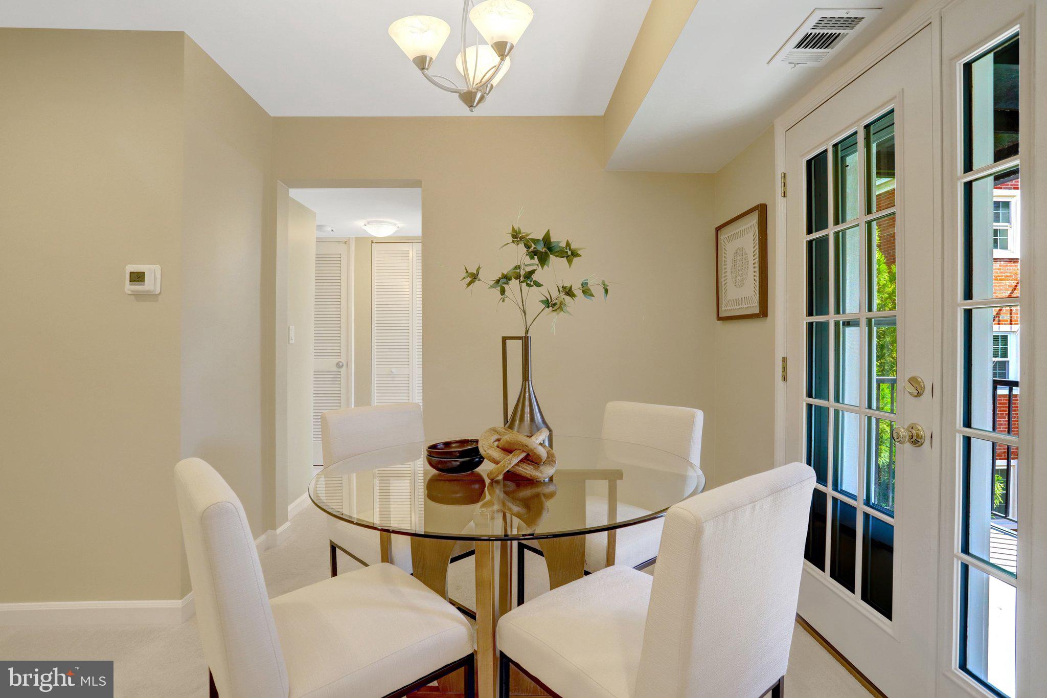4900 29th Road South, Unit B1 Arlington, VA 22206 - Photo 7 of 56 Dining area with glass door to the private balcony