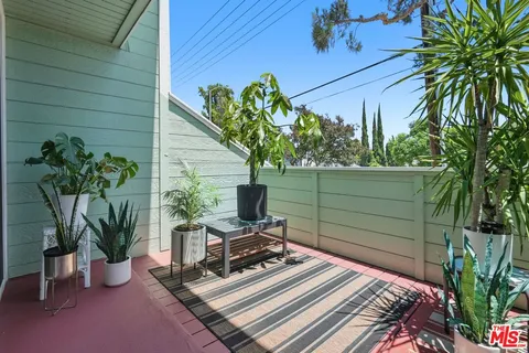 a view of a backyard with a sitting area