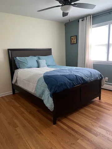 a bedroom with a bed and window