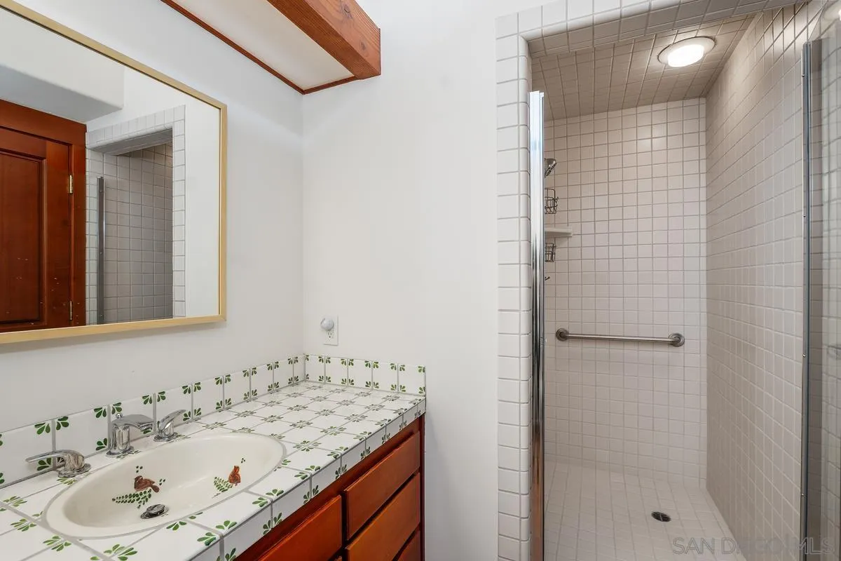 13622 Orchard Gate Road Poway, CA 92064 - Photo 35 of 40 a bathroom with a sink and a mirror