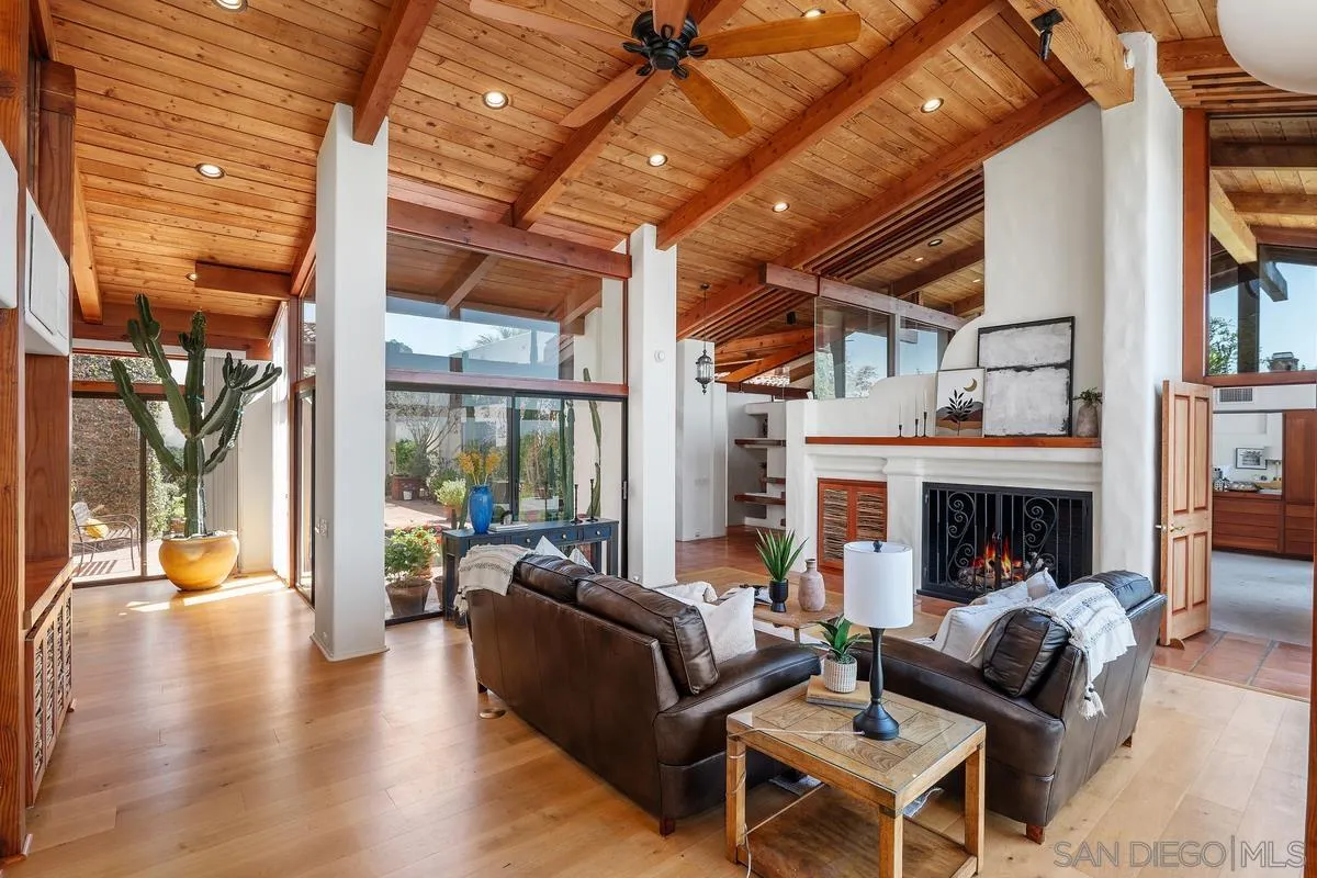 13622 Orchard Gate Road Poway, CA 92064 - Photo 8 of 40 a living room with fireplace furniture and a large window