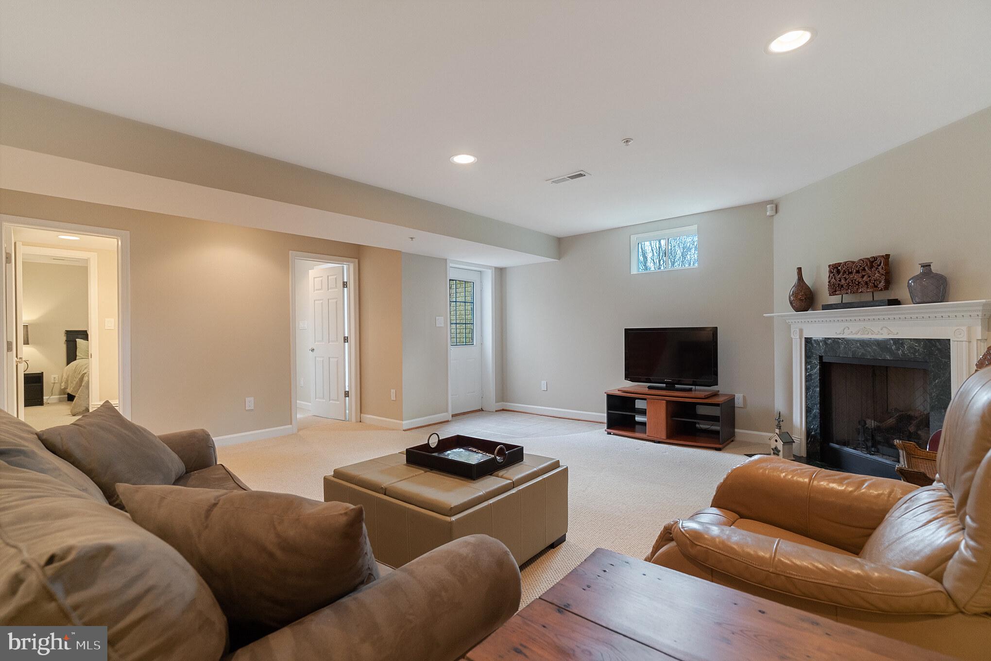 6508 Griffith Road Laytonsville, MD 20882 - Photo 28 of 35 Finished Basement with Gas Fireplace with Walk-Up