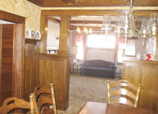 a view of a dining room with furniture window and outside view