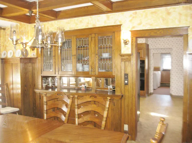 a dining room with furniture and window