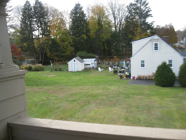 a view of a back yard with an outdoor space