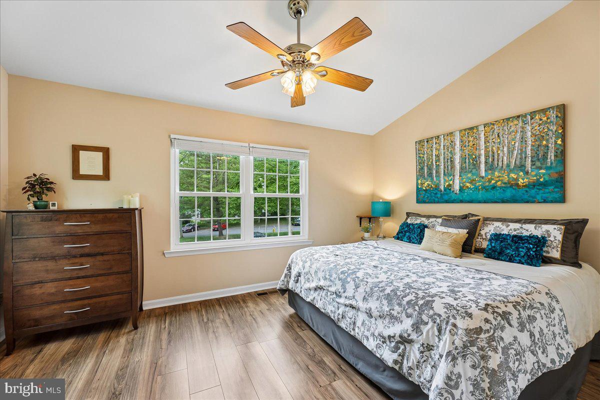 5211 Spring Branch Boulevard Dumfries, VA 22025 - Photo 12 of 32 a bedroom with a bed and a window