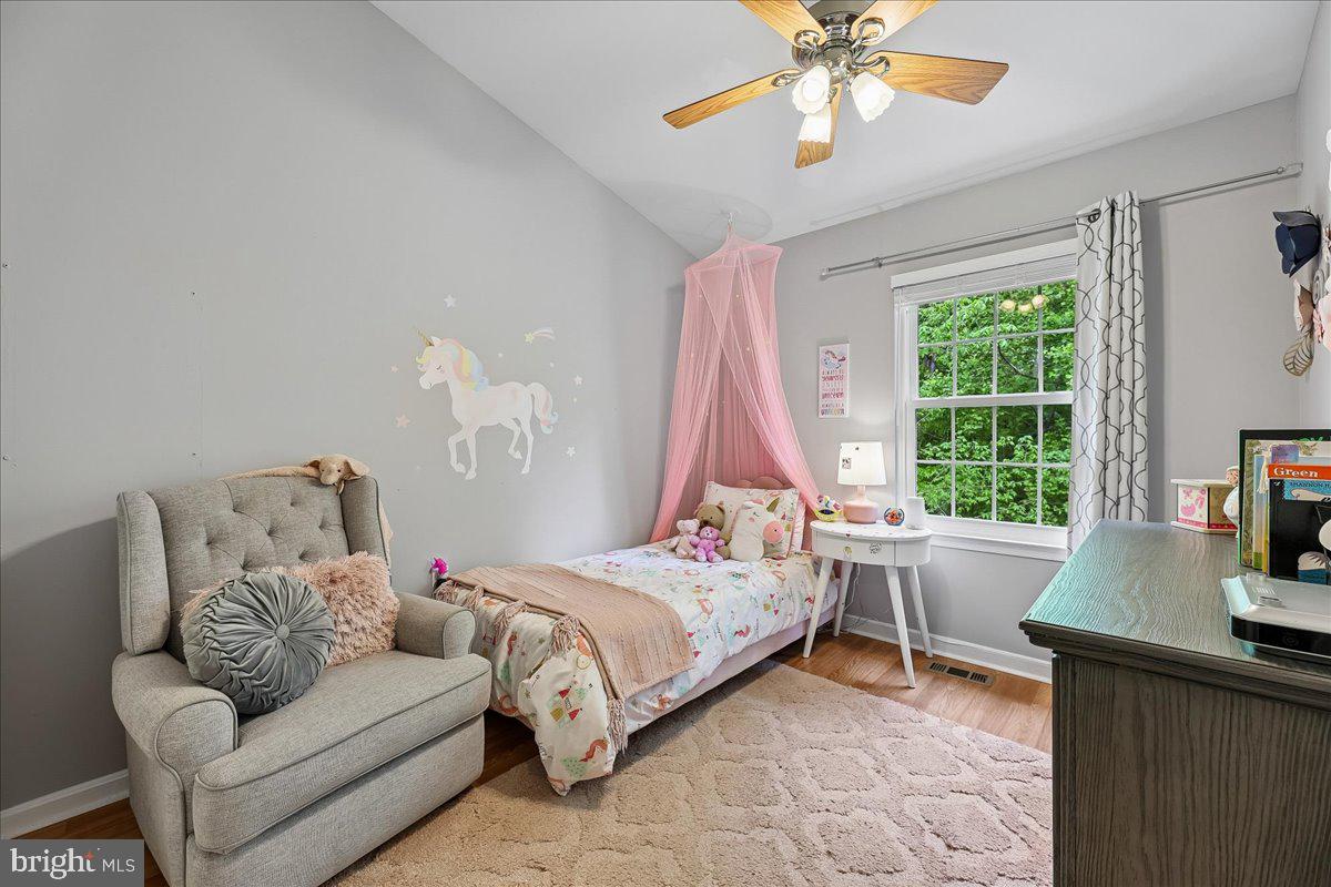 5211 Spring Branch Boulevard Dumfries, VA 22025 - Photo 15 of 32 a bedroom with a bed and a window