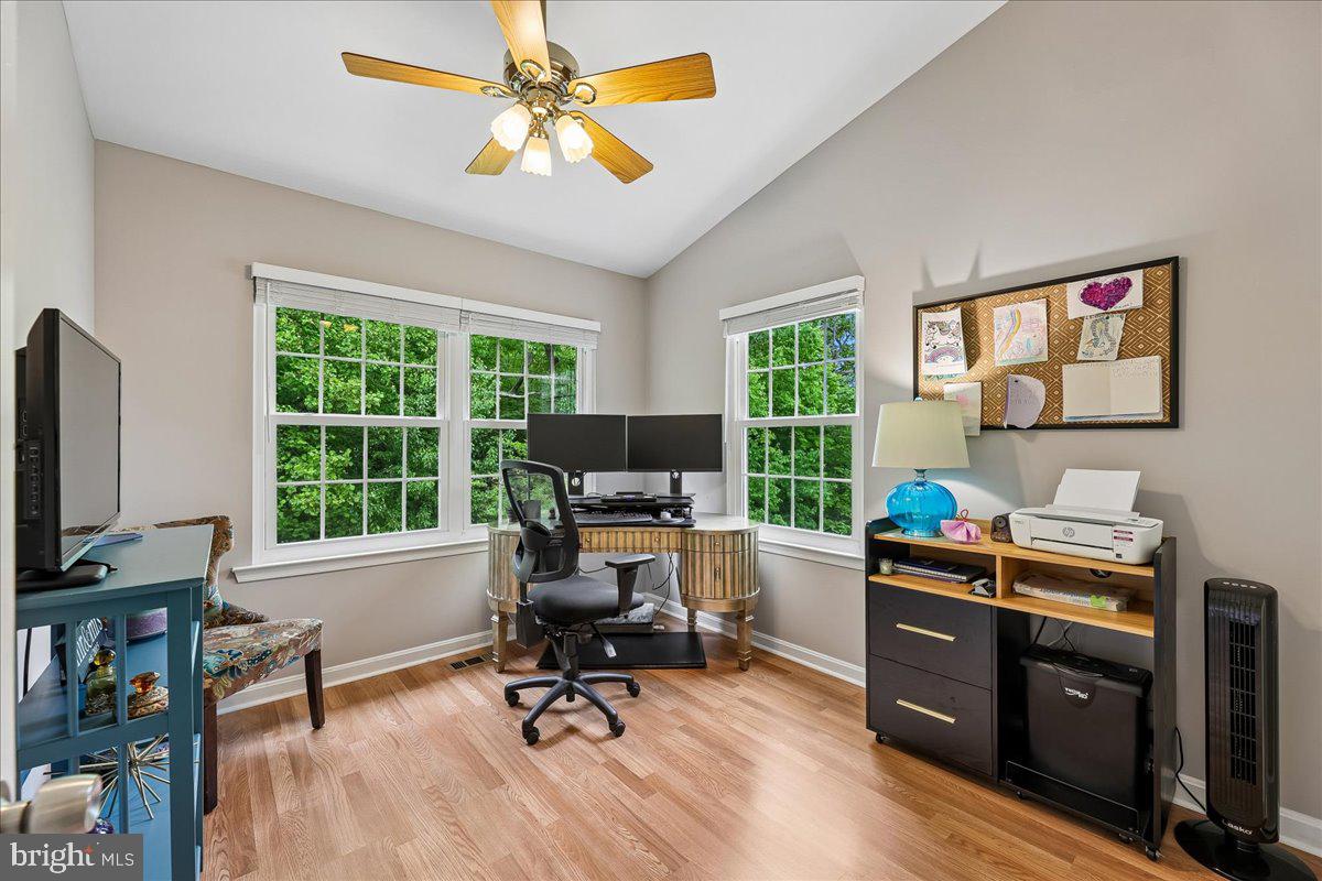 5211 Spring Branch Boulevard Dumfries, VA 22025 - Photo 16 of 32 a view of a workspace with furniture and a window