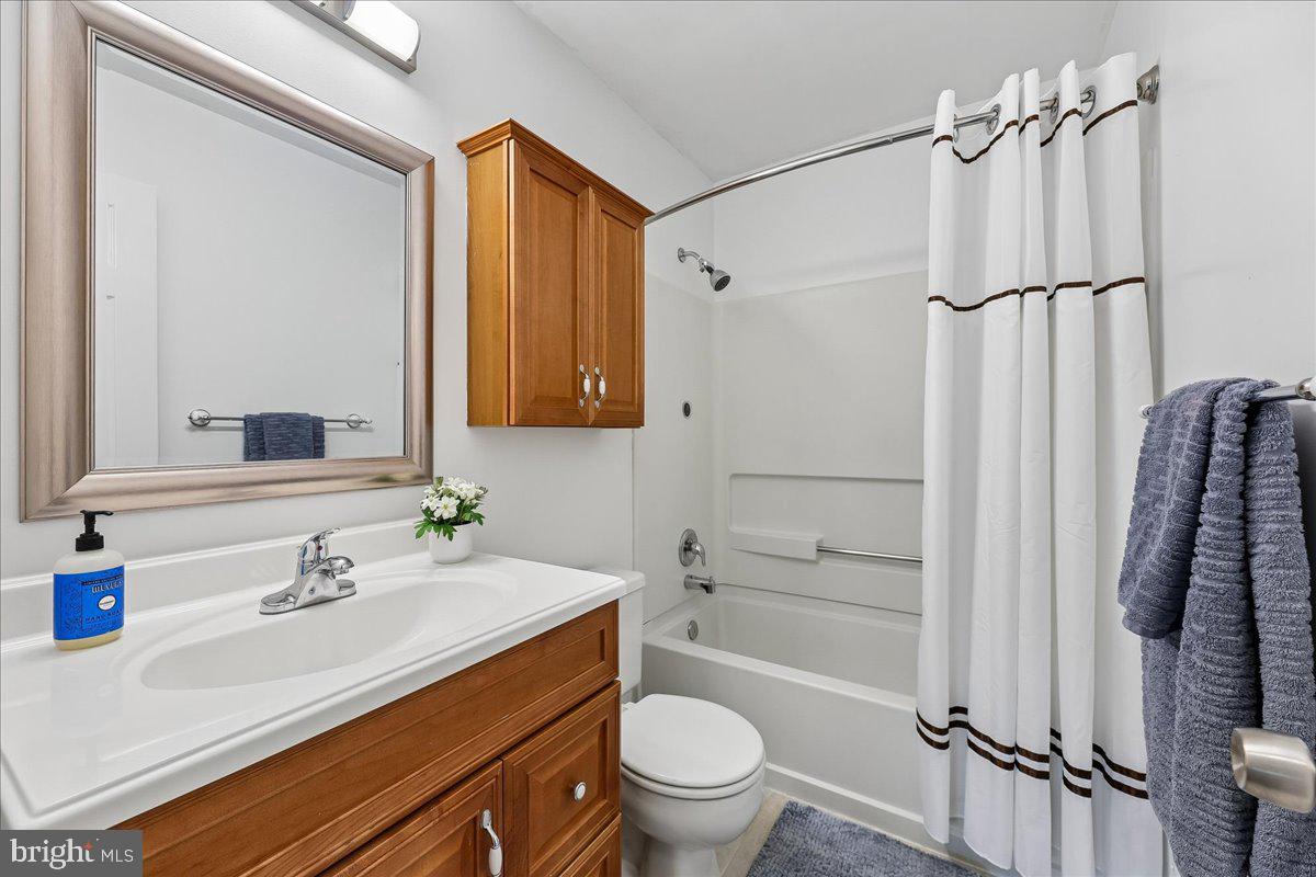 5211 Spring Branch Boulevard Dumfries, VA 22025 - Photo 17 of 32 a bathroom with a sink toilet and shower