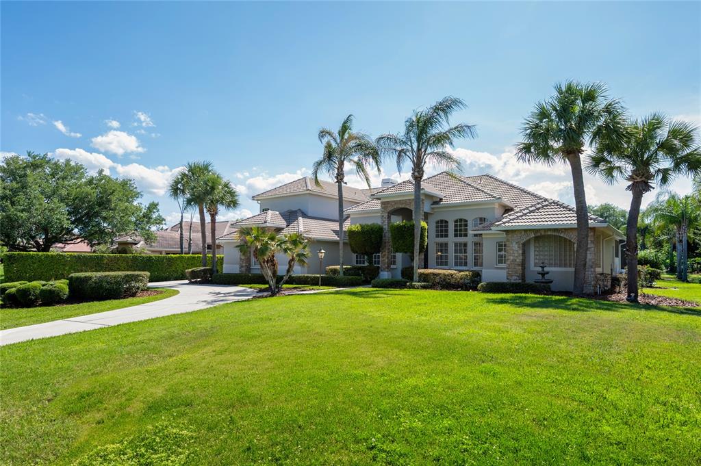 2002 Water Key Drive Windermere, FL 34786 - Photo 55 of 60 a view of a house with a yard and sitting area