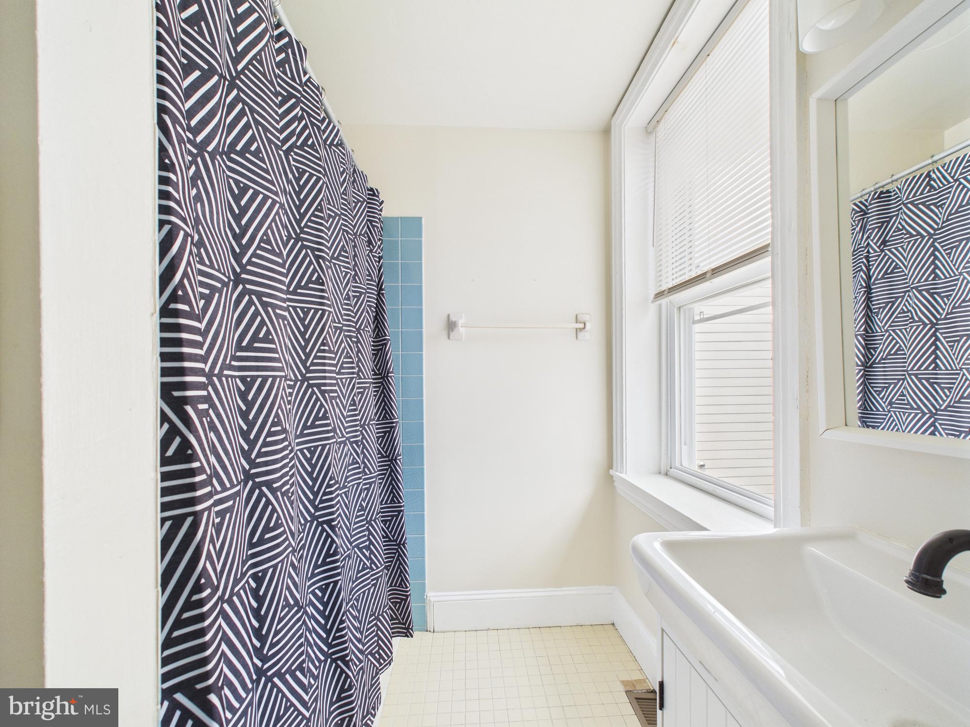 3829 Hamilton Street, Unit C Philadelphia, PA 19104 - Photo 15 of 17 a bathroom with a sink and a bathtub