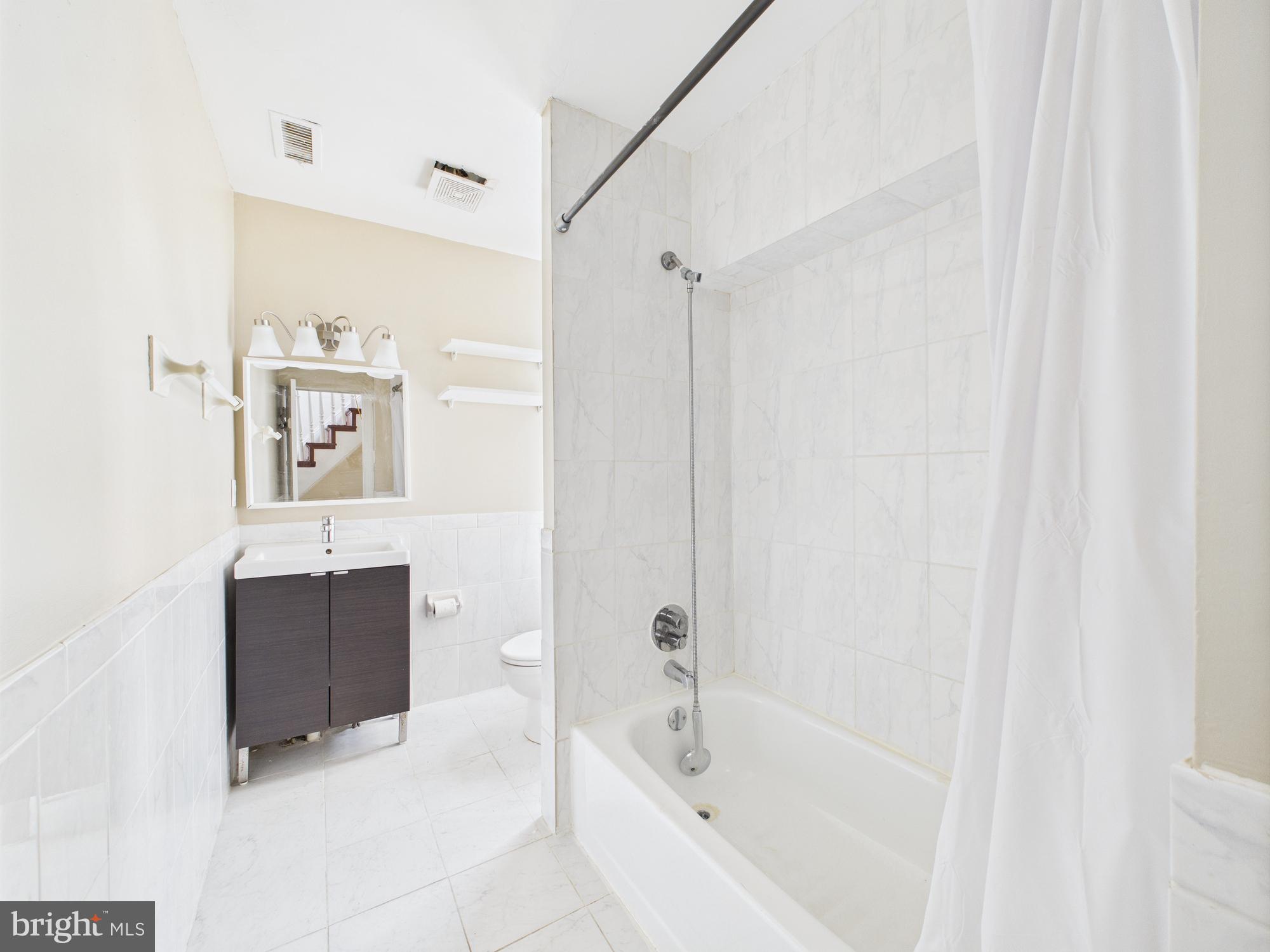 3829 Hamilton Street, Unit C Philadelphia, PA 19104 - Photo 8 of 17 a bathroom with a bathtub and a shower