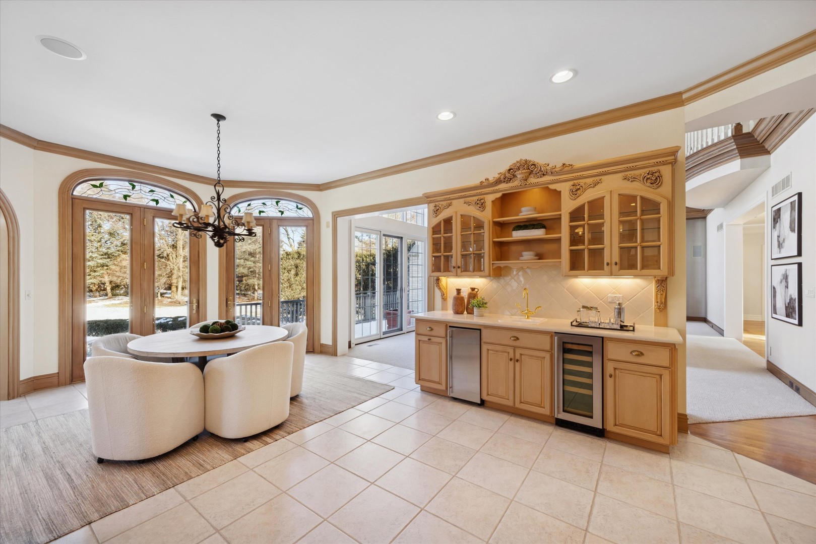 15W260 62nd Street Burr Ridge, IL 60527 - Photo 11 of 48 a large white kitchen with a large window