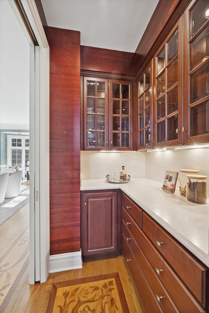 15W260 62nd Street Burr Ridge, IL 60527 - Photo 14 of 48 a kitchen with a sink and cabinets