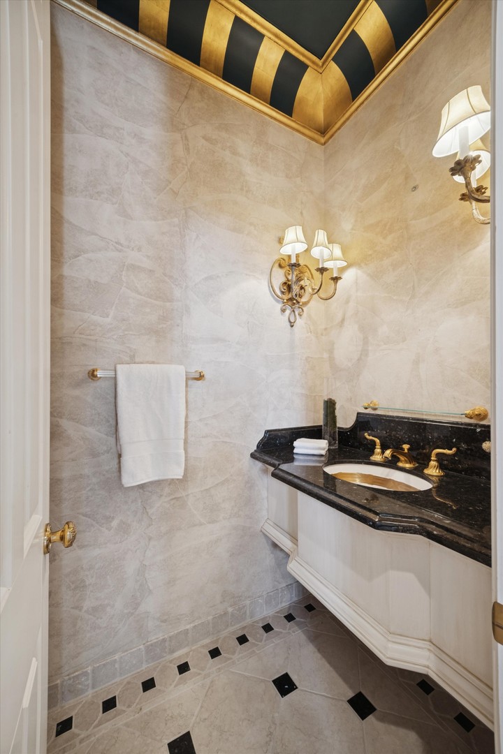 15W260 62nd Street Burr Ridge, IL 60527 - Photo 19 of 48 a bathroom with a sink and a mirror