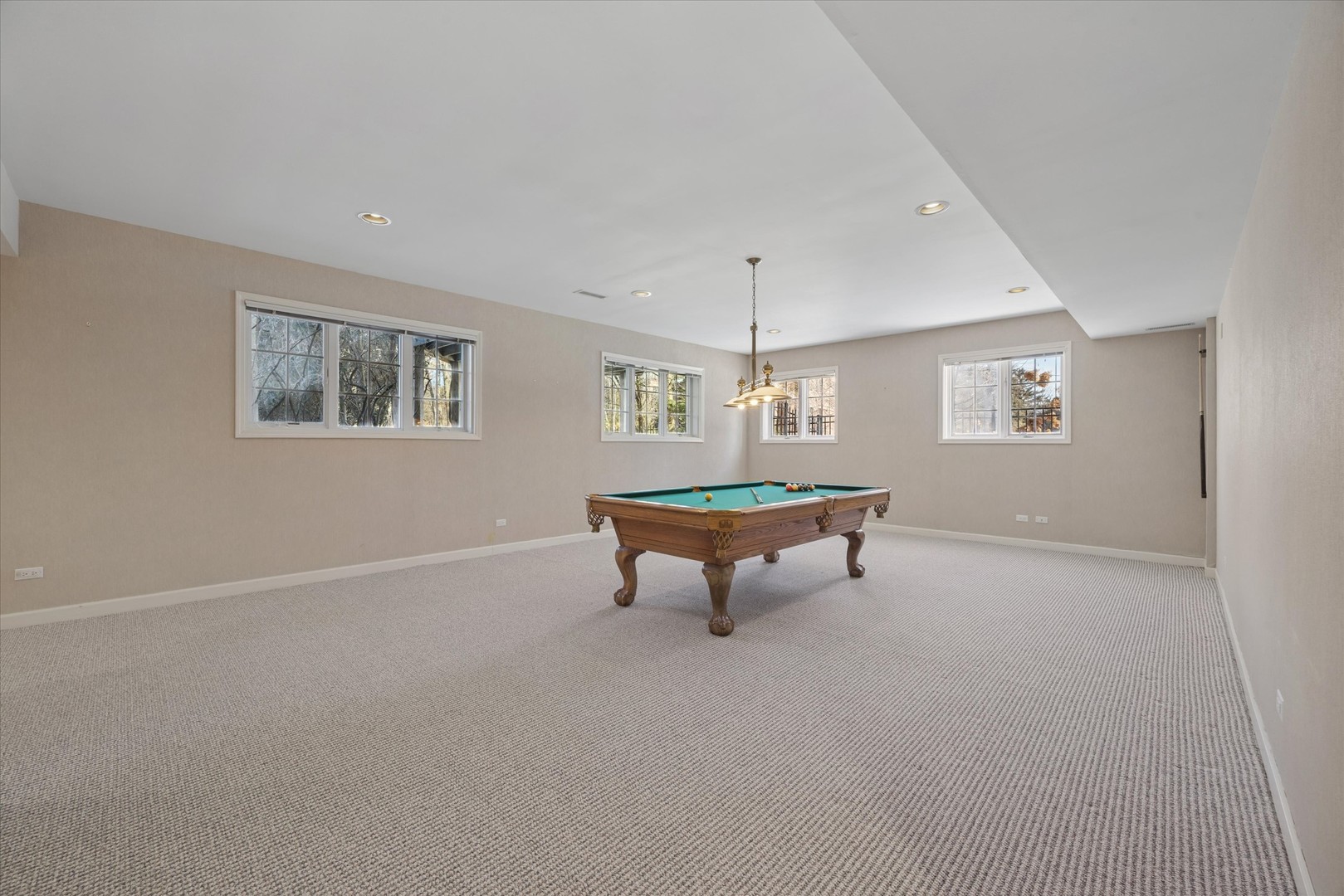 15W260 62nd Street Burr Ridge, IL 60527 - Photo 35 of 48 a room with pool table and windows