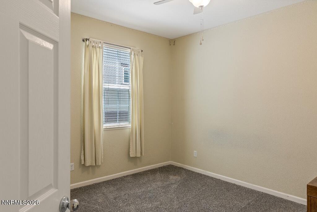 1864 Wind Ranch Road, Unit B Reno, NV 89521 - Photo 25 of 42 a view of an empty room with a window