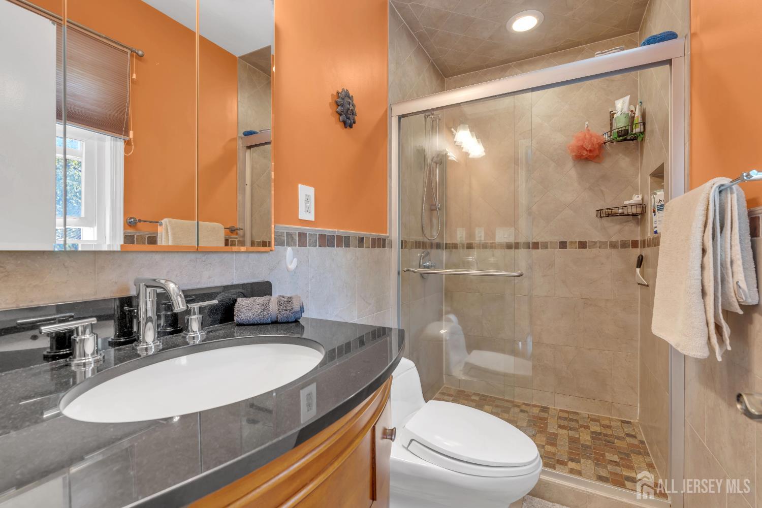 42 Ridge Road Edison, NJ 08817 - Photo 32 of 47 a bathroom with a sink toilet and shower