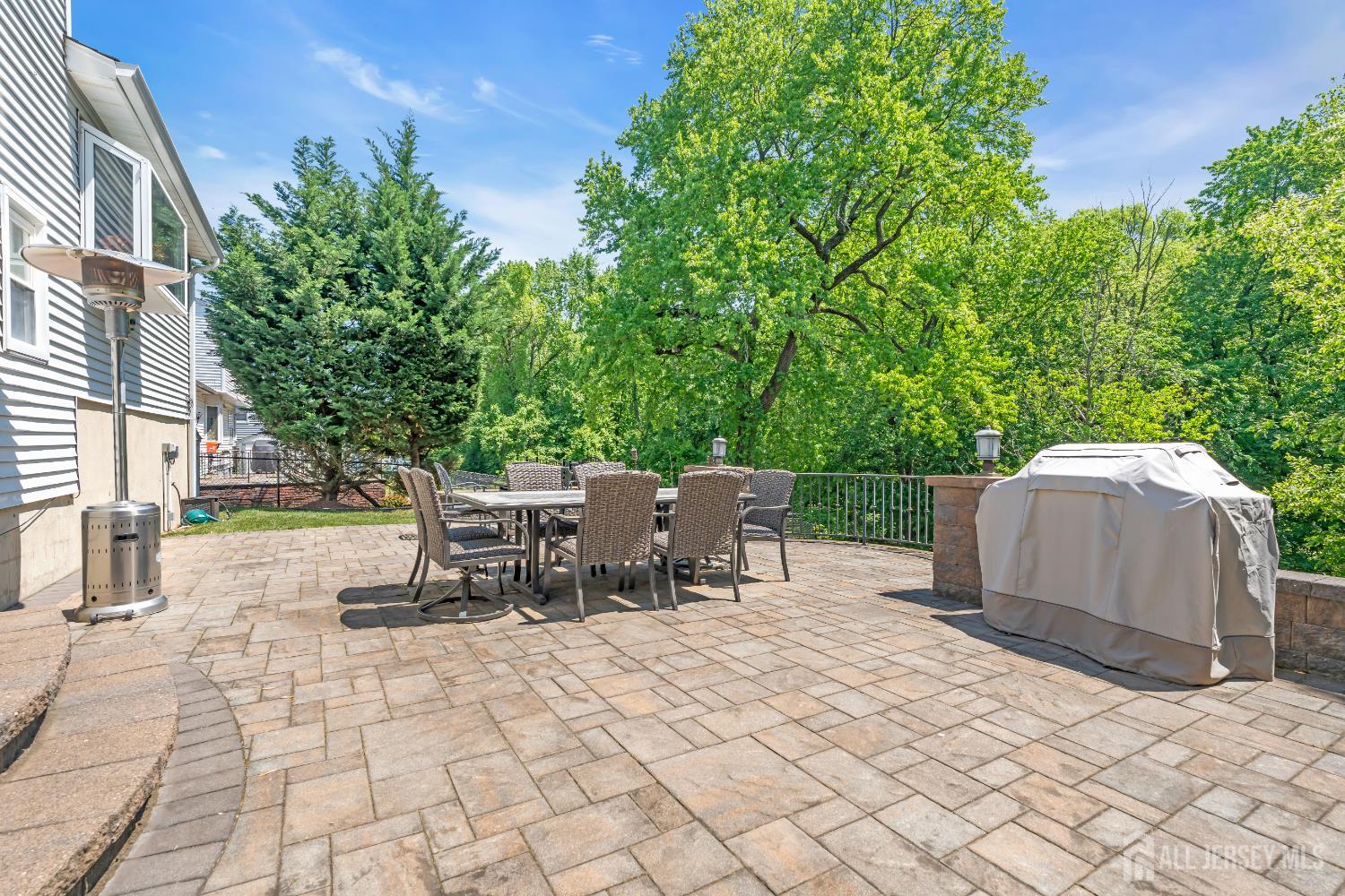 42 Ridge Road Edison, NJ 08817 - Photo 39 of 47 a view of a patio with a table and chairs
