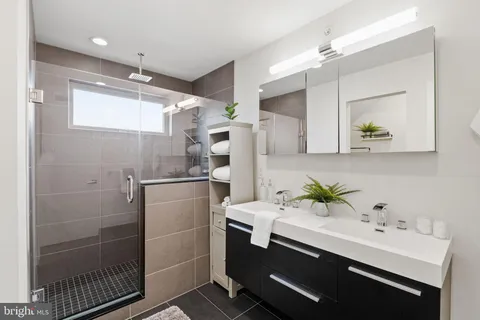 a bathroom with a shower toilet and sink