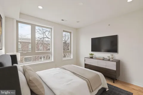a bathroom with a sink toilet and a mirror