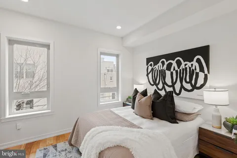 a bedroom with a bed and a table