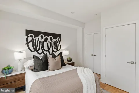 a bedroom with furniture and a window