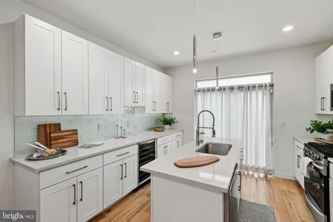 a view of outdoor sitting area with furniture and wooden fence