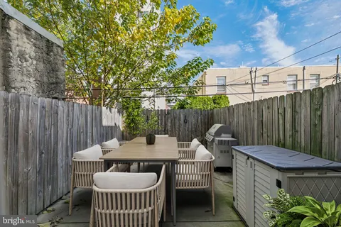 a bedroom with bed and a chandelier