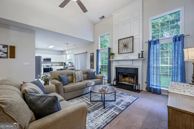 a living room with furniture window and a fireplace