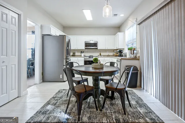 a view of a dining room with furniture
