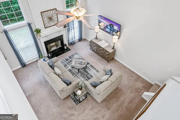 a living room with furniture and a fireplace