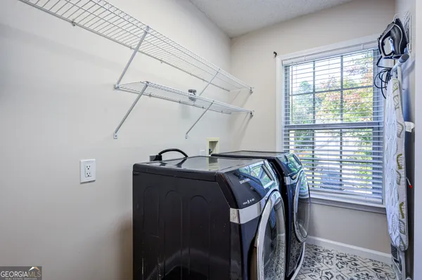 a view of storage and utility room with windows