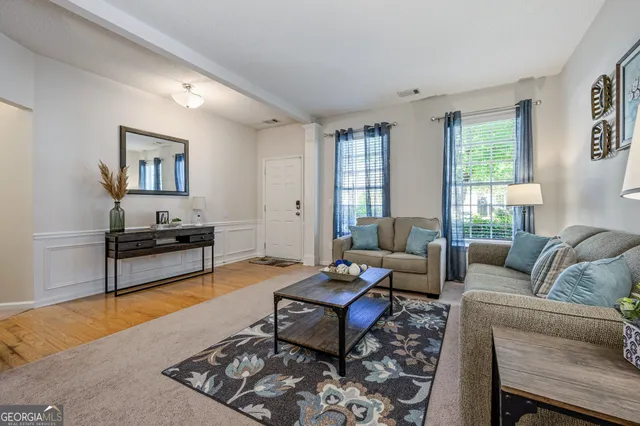 a living room with furniture and a window